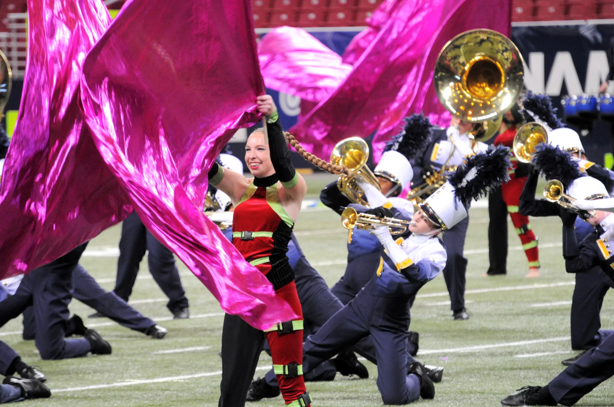 2014 oths marching band, color guard with pink flags, marching panthers on knees